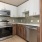 a kitchen with white cabinets