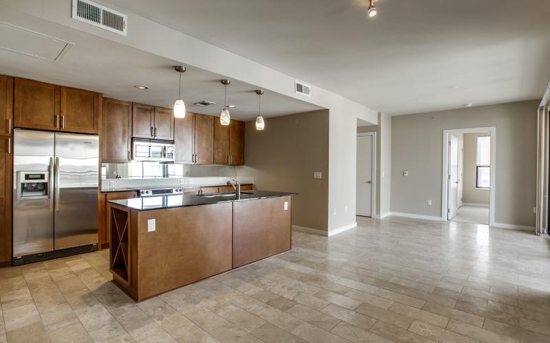 a large kitchen with stainless steel appliances