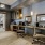 a room with a desk and chairs